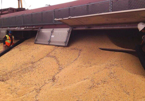 A train with a load of grain on it.